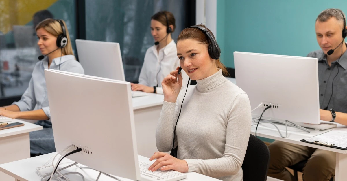 Woman, call center and smile at computer for customer support, crm or help in phone call. Consultan